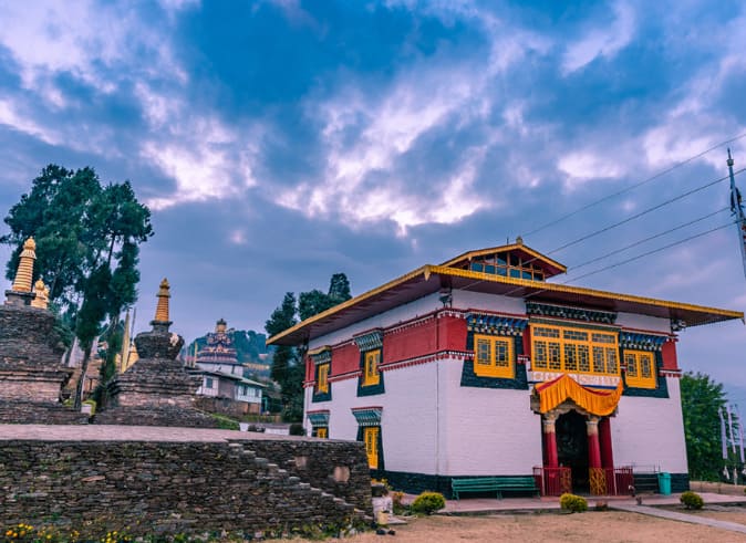 Pemayangtse Monastery: Pemayangtse Monastery in Pelling with prayer flags and Kanchenjunga range in the background
